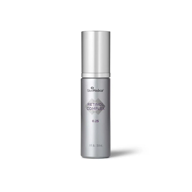 Silver skincare bottle labeled 'Retinol Complex' on a white background